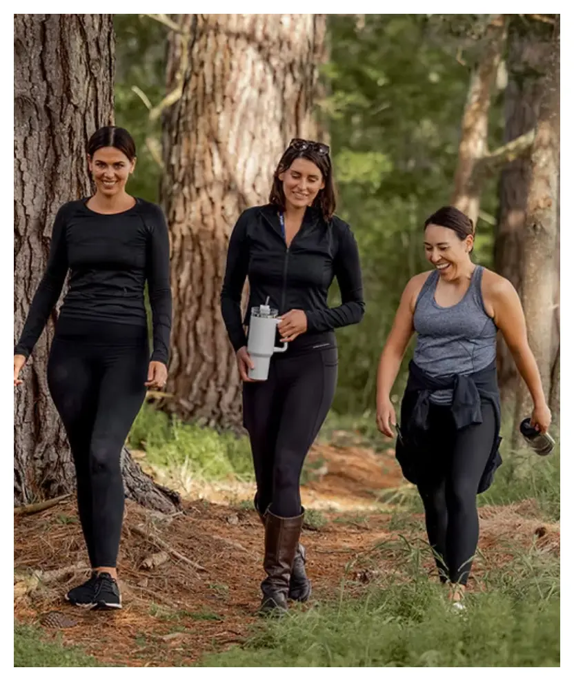 Guests walking through woodland near Karapiro Villas Resort